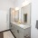 Bathroom with grey cabinets and double vanity