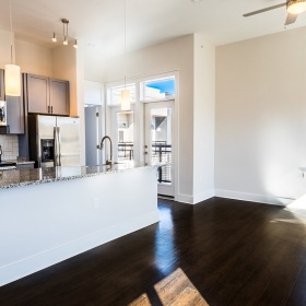 Kitchen with an island and wood-style flooring