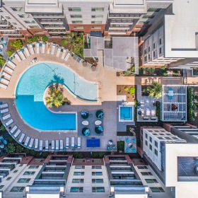 Sky high view of the pool and outdoor community spaces